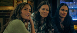 RANSOM CANYON, SEASON 2. (L to R) Minka Kelly as Quinn, Lauren Glazier as Angie O'Grady, and Marianly Tejada as Ellie in Episode 205 of Ransom Canyon Season 2. Cr. Courtesy of Netflix © 2026